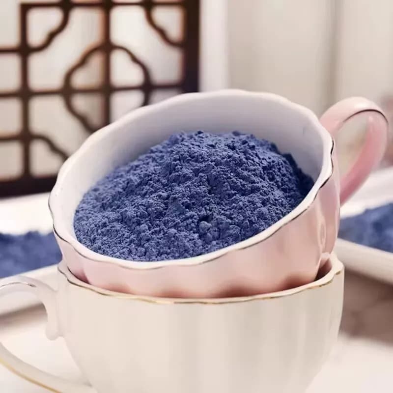 Vivid blue superfood latte and smoothie bowl prepared with butterfly pea powder
